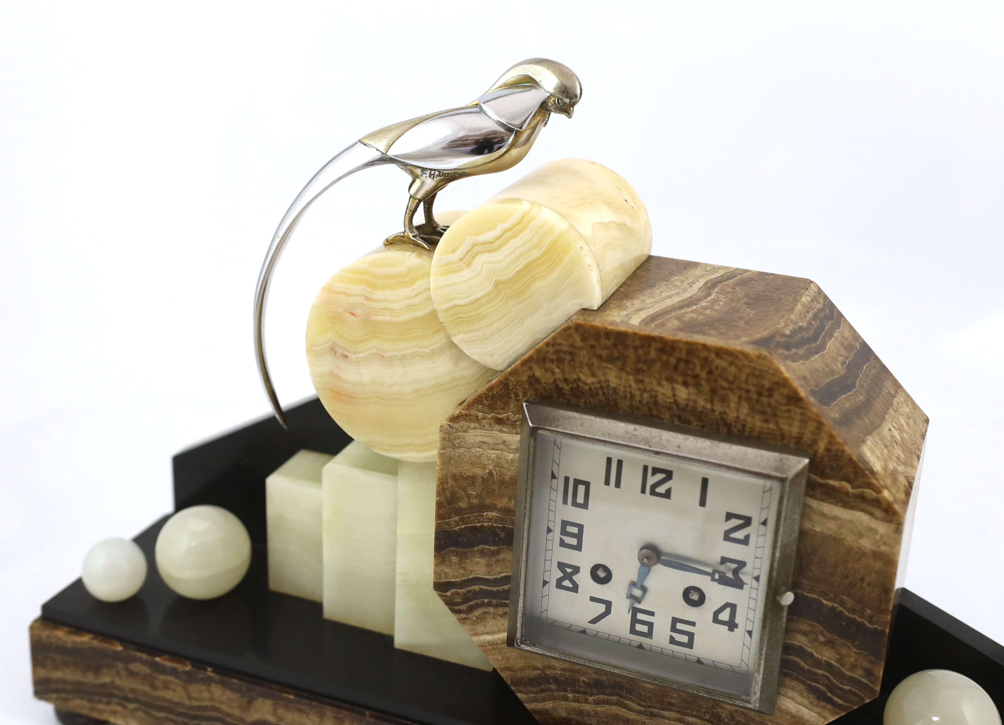 F.H. Danvin, a French Art Deco onyx and marble mantel clock